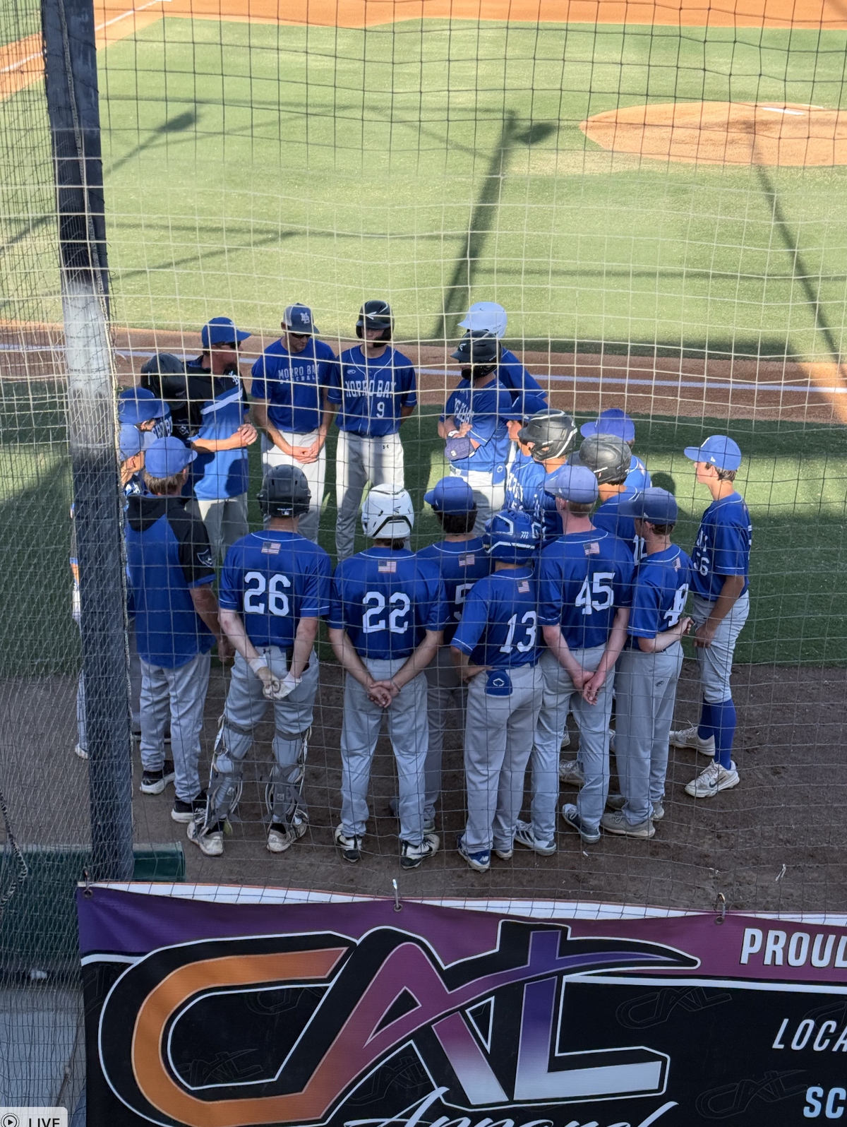 Morro Bay High huddles before its CIF-Central Section Division 3 playoff game versus Fowler. The Pirates (26-6) lost 10-1.