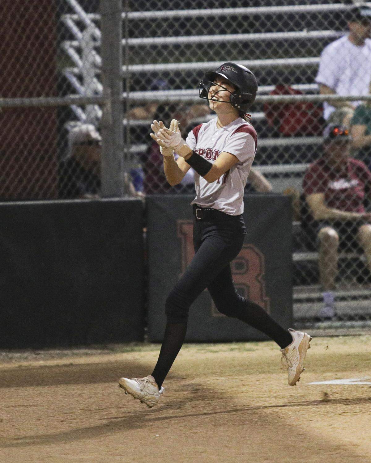 Alie Camacho celebrates scoring the first run of the game. Nipomo beat Paso Robles 3-1 in a softball game delayed by heat on March 17, 2026.