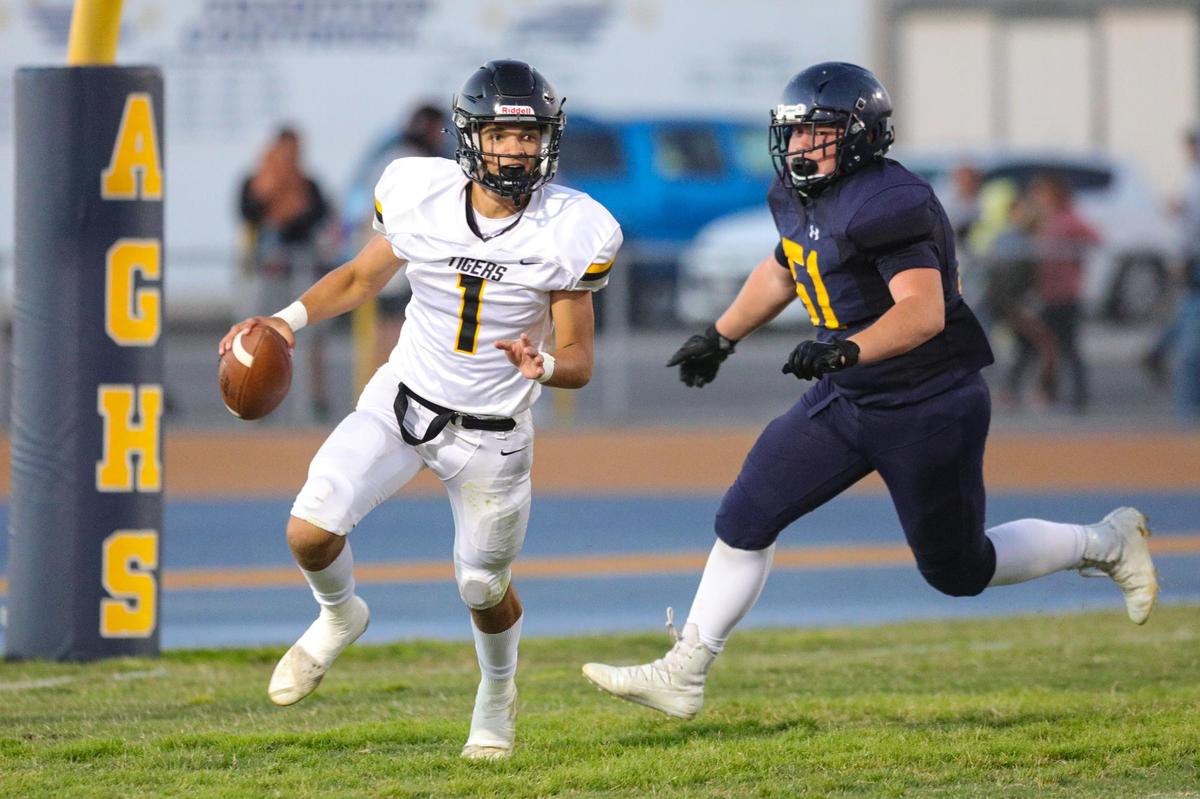 Blayke Perry is under pressure from Isaih Chavez. San Luis Obispo traveled to Arroyo Grande for a football game.