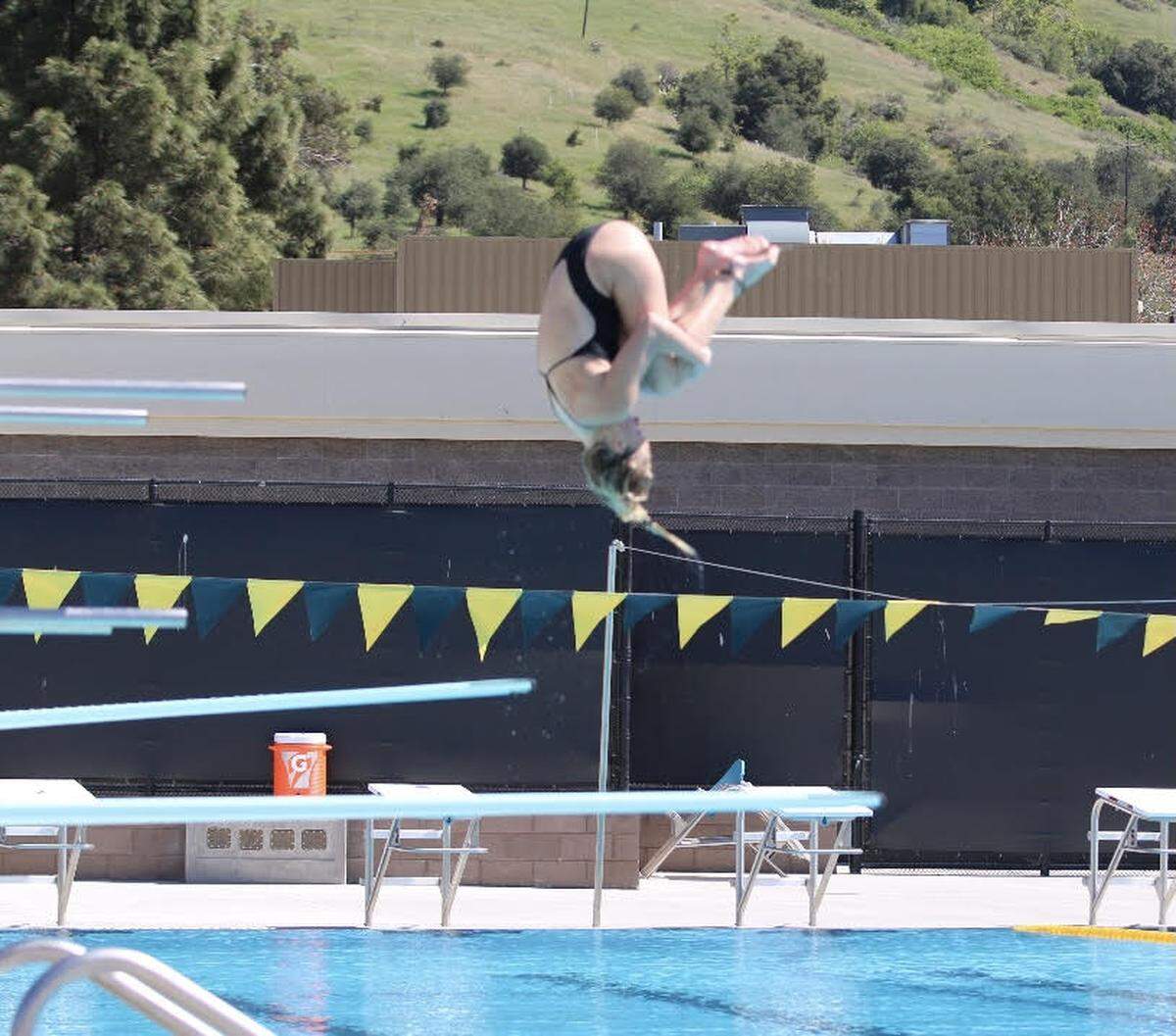 Malia Maire dives for San Luis Obispo High School. Maire, a senior, won the CIF-Central Section championship in Division 1 diving this season.