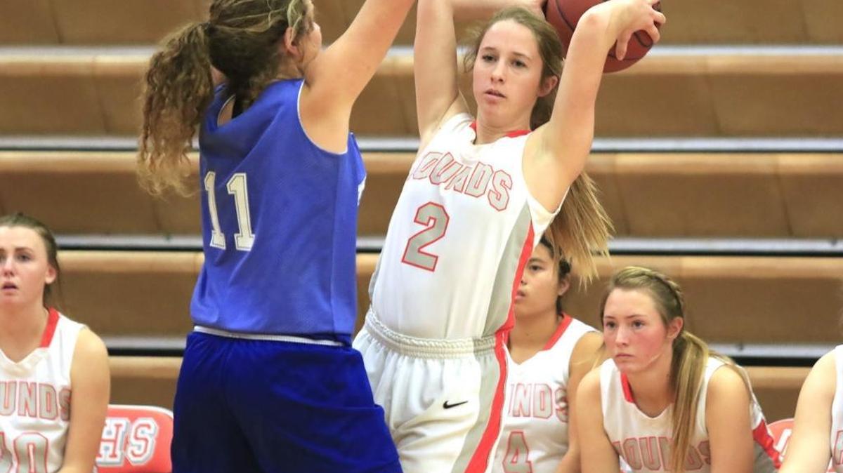 Atascadero High’s Abby Richey (2) looks to pass while defended by Morro Bay’s Juliana Ruef during the Greyhounds’ 55-33 win Saturday at the Ruth Doser Tournament.