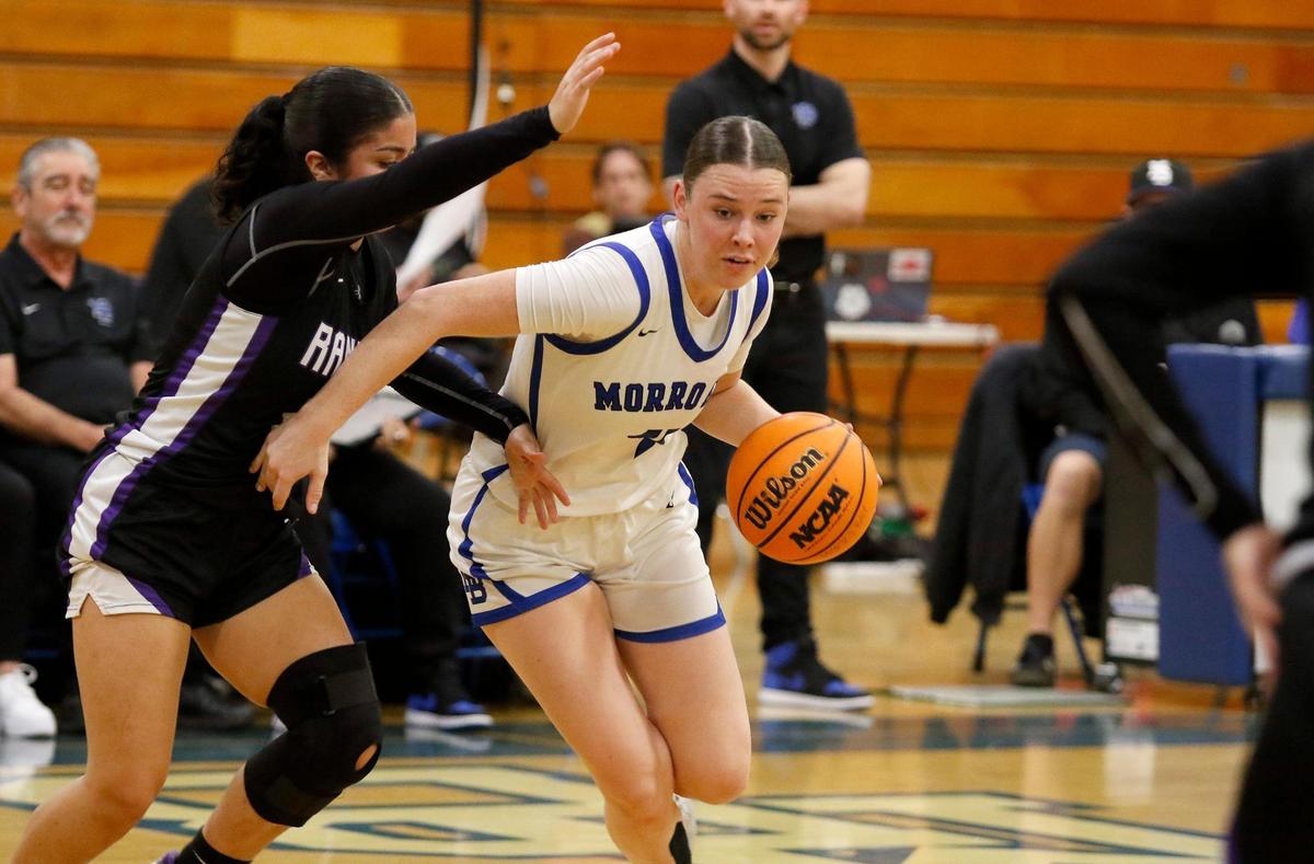 Morro Bay High School girls basketball team beats Rancho Cucamunga 49 - 29 in the CIF state playoffs at Morro Bay High School, Tuesday, Feb. 27, 2024. Fiona Durham (4) dribbles under pressure from Rancho Cucamunga’s Vivian Valencia (22).