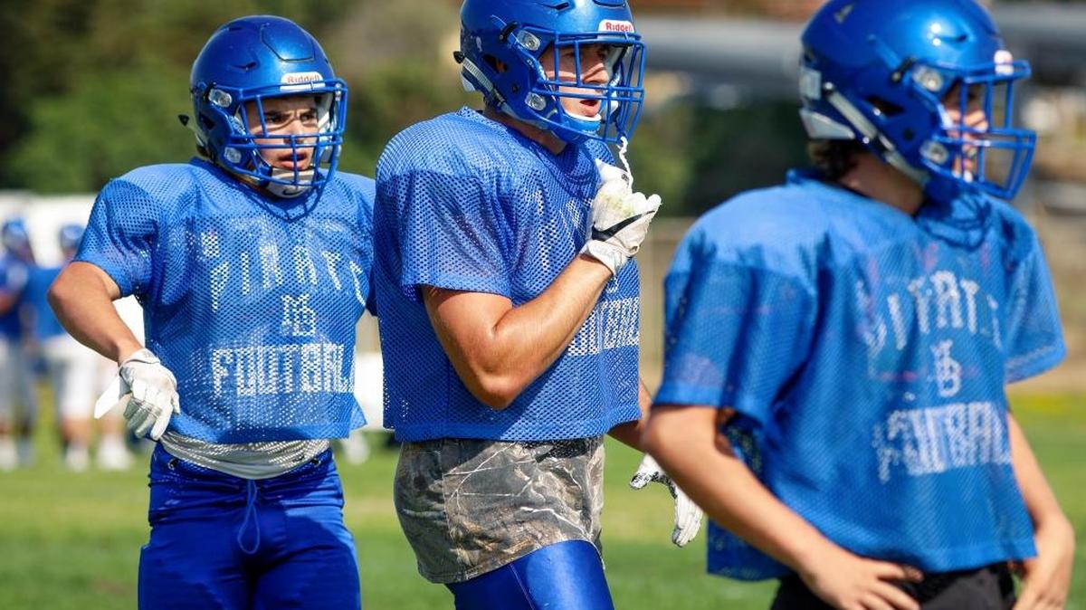 Morro Bay senior running back Myles Minnis (center), shown here during preseason practice, looks to lead the Pirates to its first win of the season at home Friday against SLO High.