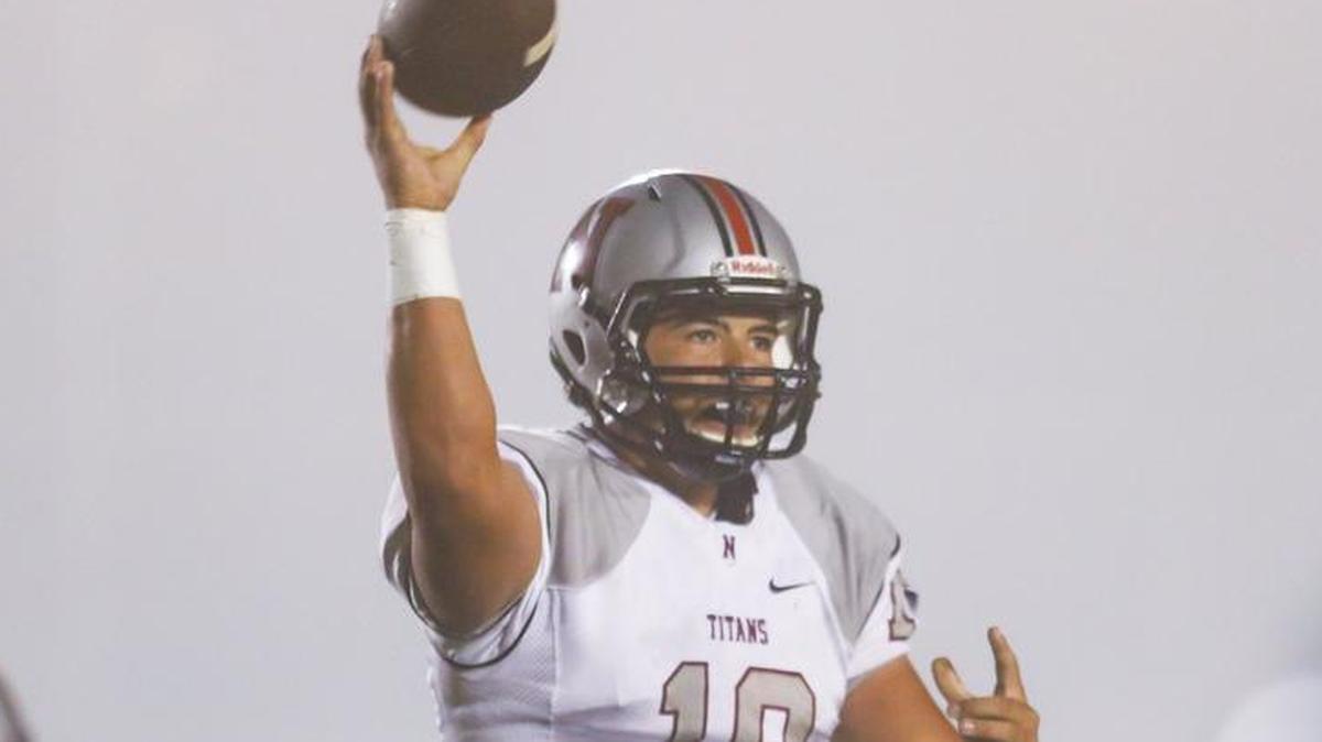 Nipomo quarterback Brayden Groshart (18) led the Titans to a 52-0 victory Friday night at Morro Bay.