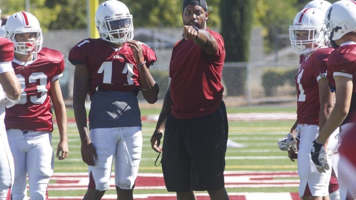 Paso Robles High head coach Larry Grant leads his team during preseason practice. David Middlecamp 8-14-2017