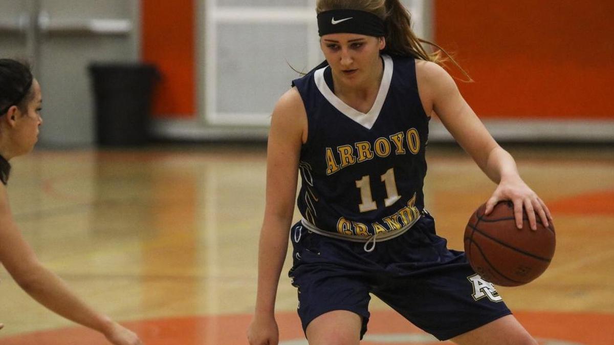 Arroyo Grande senior Brynn Thoming dribbles between her legs in a game against Atascadero.