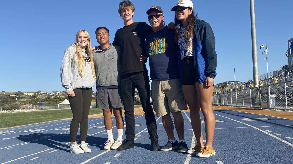From left to right, Madeline Scovil, Geo Abuan (coach), William Dawes, James Brown (coach) and Daniela Ruelas celebrate the success of the Arroyo Grande athletes after the CIF state final. The three Eagles placed in the Top 10 in California.