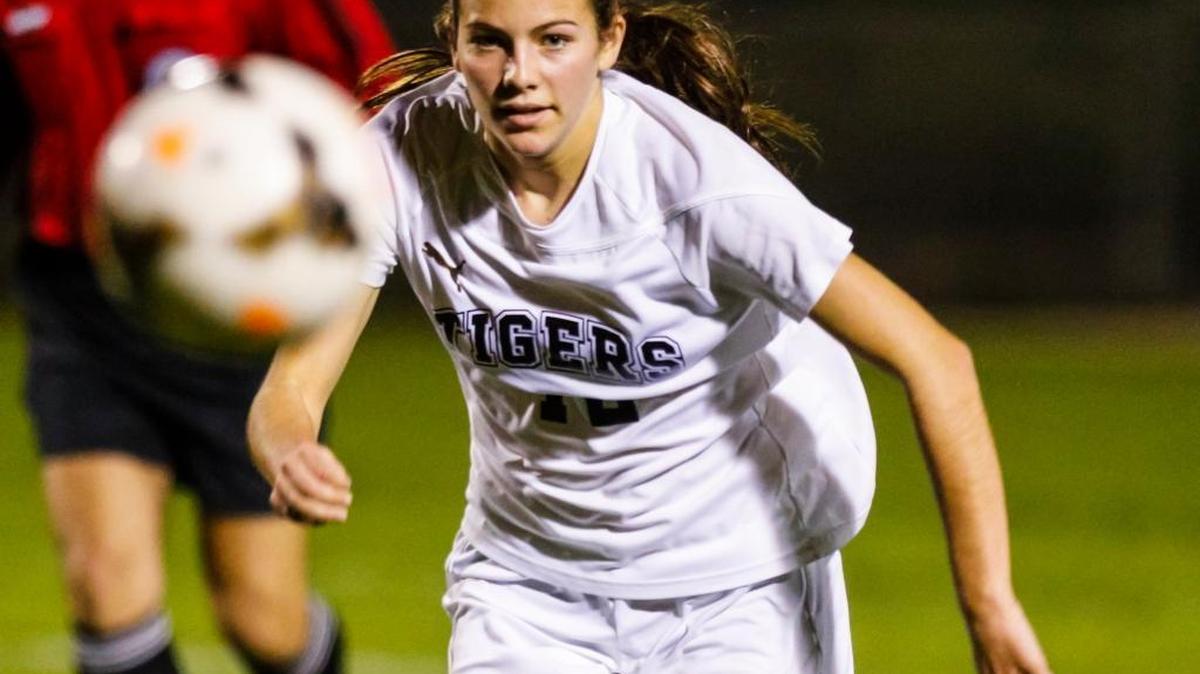 San Luis Obispo High’s Grace Park chases a loose ball during the Tigers’ win over St. Joseph on Feb. 10.