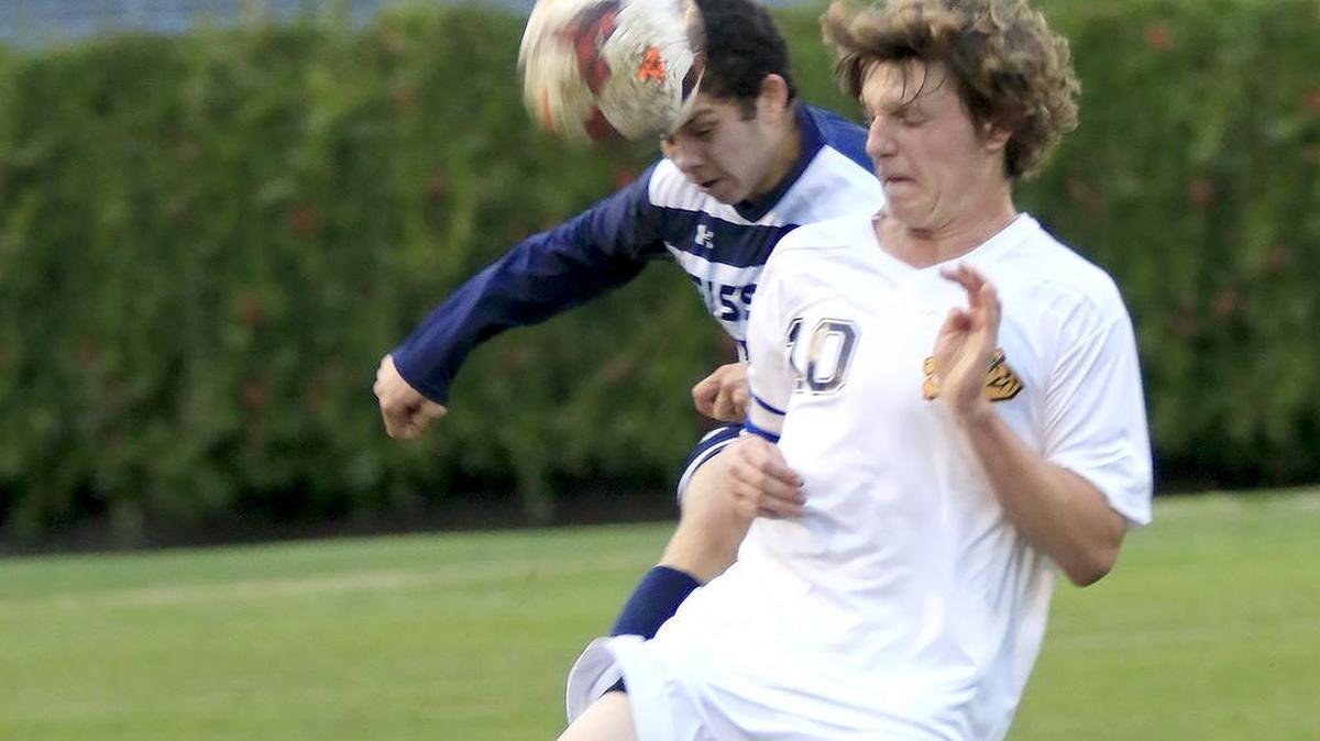San Luis Obispo High’s Brian Finger (10) battles with Mission Prep’s David Christianson during first-half play of The Tigers’ 5-0 win Friday.