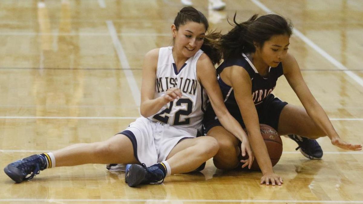 Mission Prep’s Jenna Lee dives for the ball with Mylee Madrazo of Oxford Academy. Hard-fought defense was the Royals’ calling card in a 40-22 victory in a CIF-State Girls Basketball Championships Division V second-round playoff game Saturday.