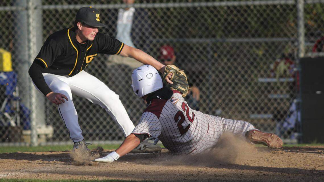 Jay Lopez scores on a wild pitch under a tag by Tyler Blaney. San Luis Obispo beat Paso Robles 5-4 in a high school baseball game April 23, 2026