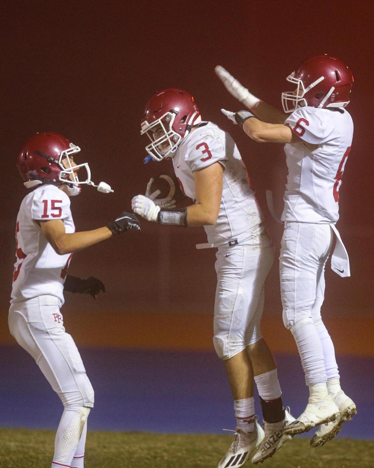 Diego Chavez, Jake Morones and Cole Raymond celebrate a touchdown. Paso Robles fell to Arroyo Grande 62-35 on Oct. 29, 2021. The Eagles and Bearcats each earned a share of the Mountain League title.
