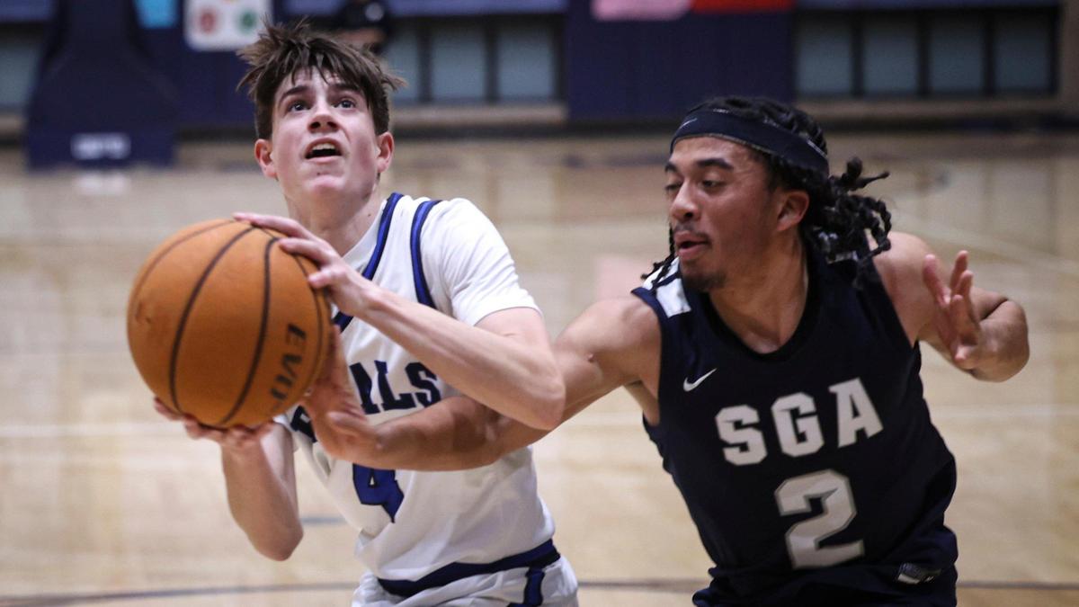 Brody Miller has shot disrupted by Marquise Humphreys. Mission Prep lost to San Gabriel Academy in the CIF state Division 3 basketball tournament on March 6, 2025.