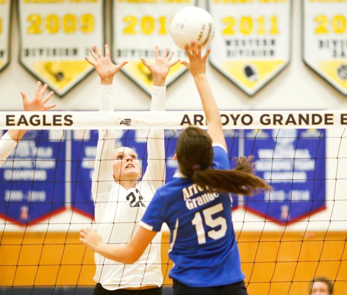 San Luis Obispo High’s Holland Boege, left, goes for the block against Arroyo Grande’s Ashley Kay during the teams’ 2016 season in volleyball.