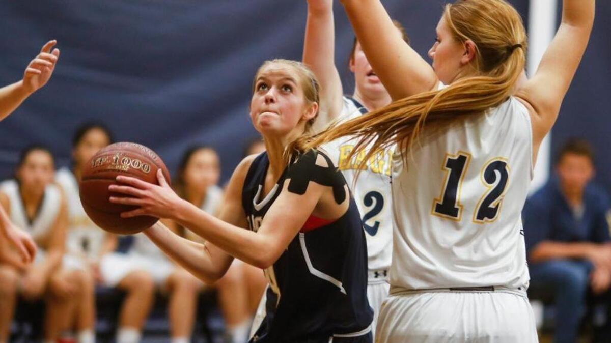 Mission Prep Jaqueline San Jule drives to the hoop in a game against Arroyo Grande on Jan. 11.