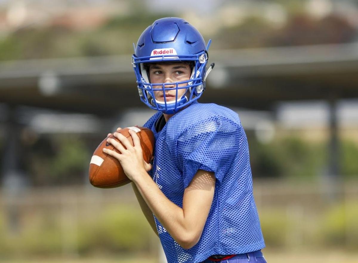 Morro Bay High School junior Aidan Moriarty drops back to pass during a recent practice. Photo by Joe Johnston 08-10-17
