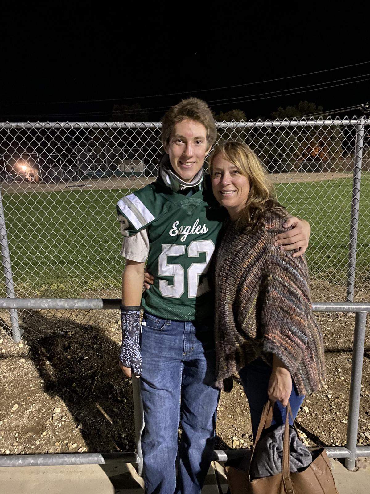 Walker Craven, a Templeton football player, was badly injured last year while being hit by a truck riding his bike to a morning weightlifting workout. He’s pictured here after the accident with his mother, Katie Sullivan.