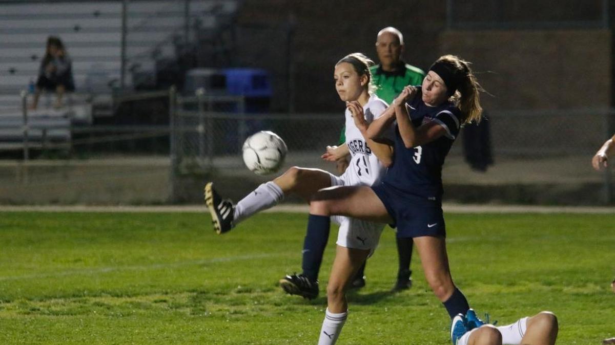 San Luis Obispo freshman Amber Nunes battles for position with a Yorba Linda defender in the semifinals of the CIF-Southern Section girl’s soccer semifinal on March 1.