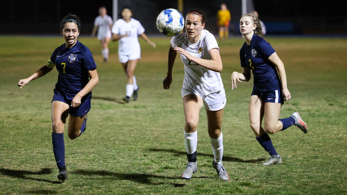 Pursuing the ball from the #7 Angie Tapia and #2 Presley Dunkle of Arroyo Grande and #23 of San Luis. Arroyo Grande won in an overtime shootout against San Luis Obispo in girl’s soccer Feb. 11, 2022.