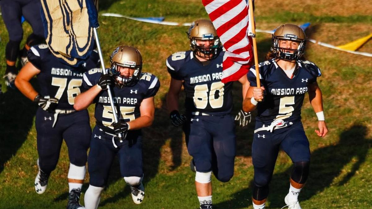 Mission Prep players run into the field before a non-league game against Linfield Christian on Sept. 30.