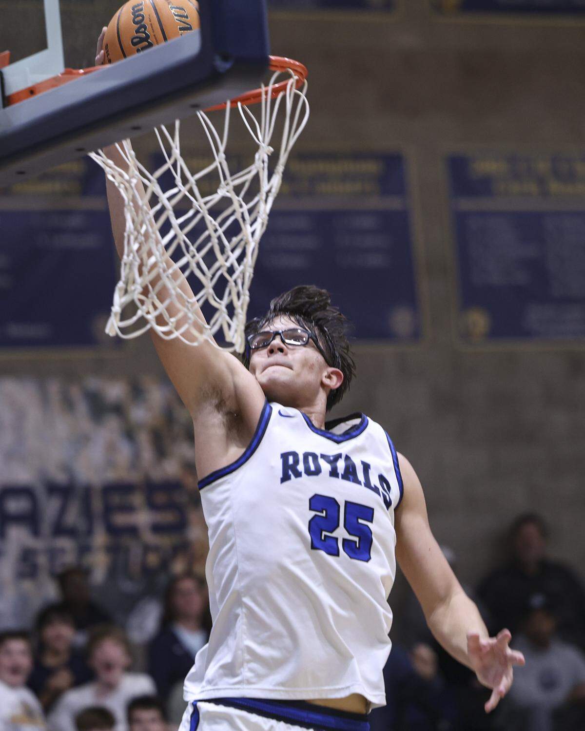 Kason Nico dunks on a breakaway. Mission Prep boy's basketball team beat Lemoore 69-43 on Feb. 13, 2026 in the first game of ;the playoffs.