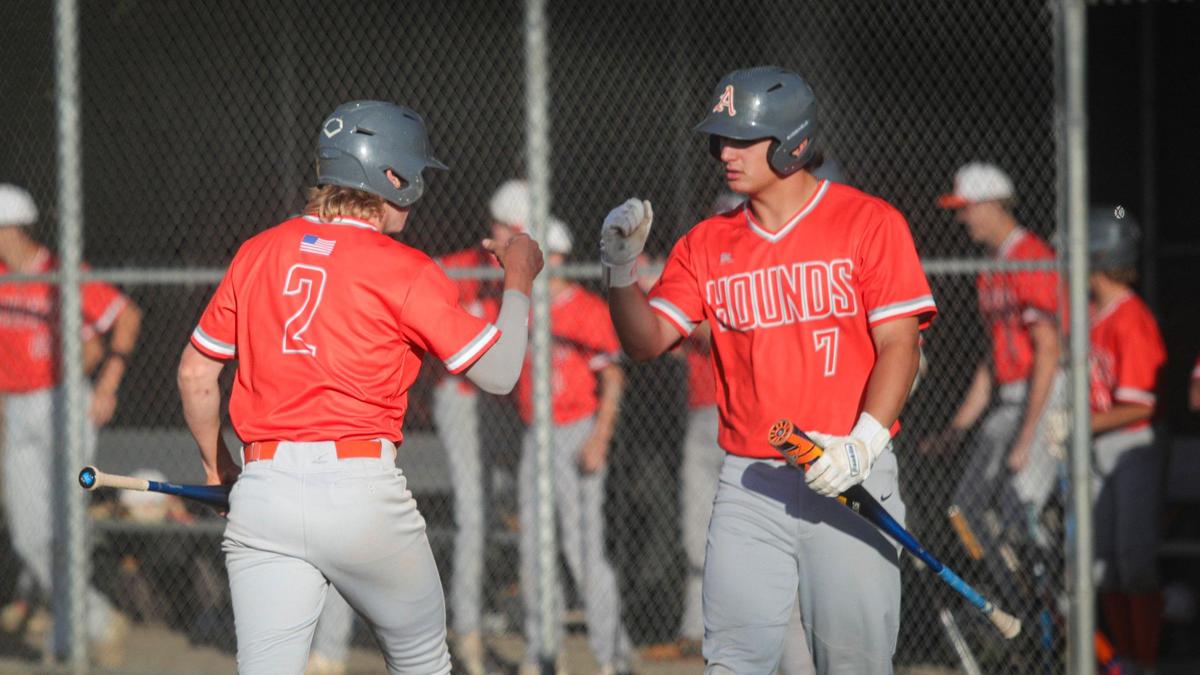 Jarom Damery, left, gets congratulations after scoring from Chase Viale. Atascadero won 8-3 over San Luis Obispo in a baseball game May 3, 2024.