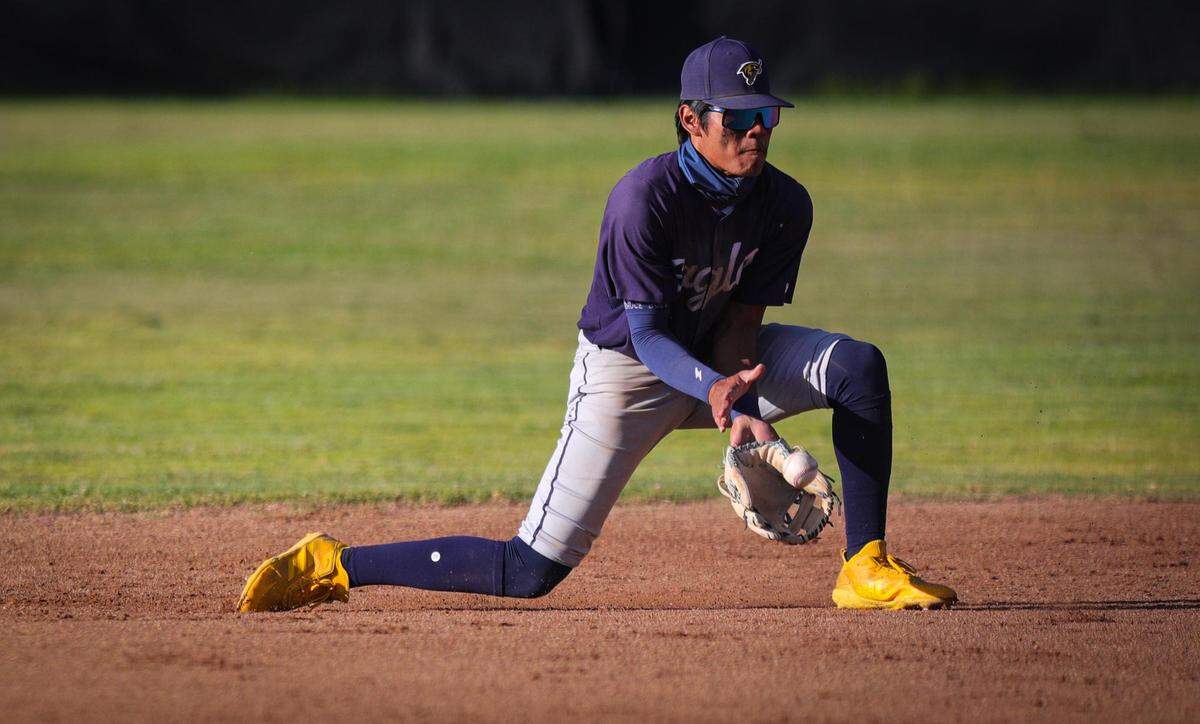 Josiah Cabreros fields a grounder for the Eagles. San Luis Obispo won 3-1 over Arroyo Grande in a baseball game in SLO May 12, 2022.