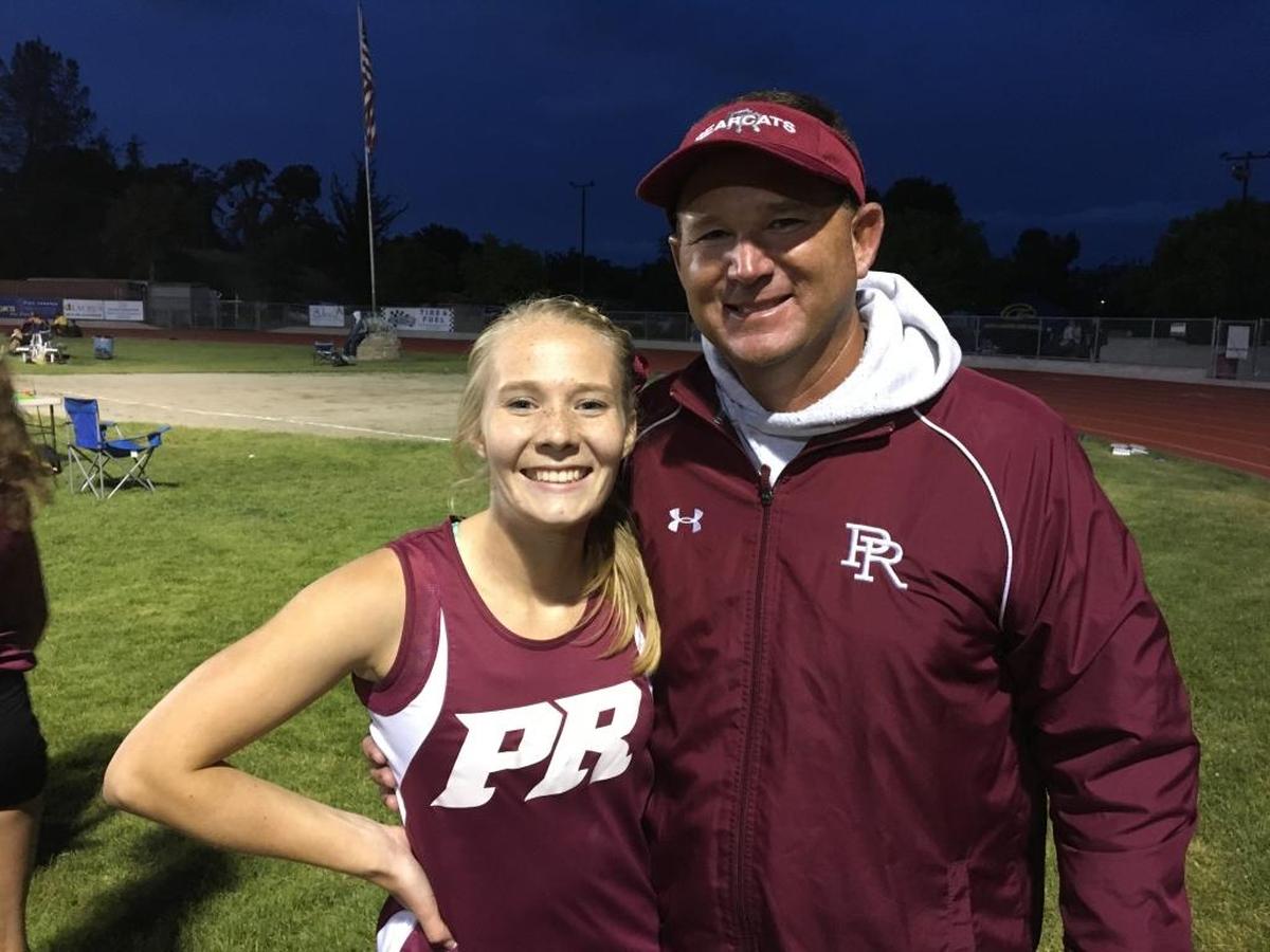 Paso Robles pole vaulter Codie Wilshusen poses with her father Jim Wilshusen after setting a school record at the 2016 PAC 8 Finals.