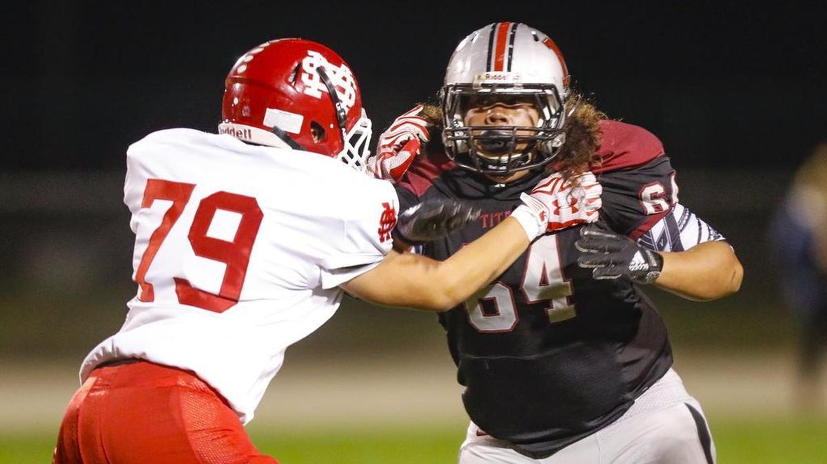 Elyaz Pu’a (right) plays in his final regular season game for the Nipomo High School football team Friday in a loss to Santa Maria.