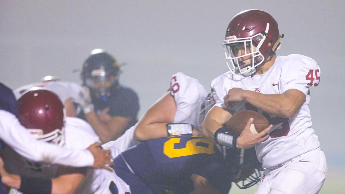 Devin Mowreader runs with the ball in Paso Robles’ 62-35 loss to Arroyo Grande on Oct. 29, 2021. The Eagles and Bearcats each earned a share of the Mountain League title.
