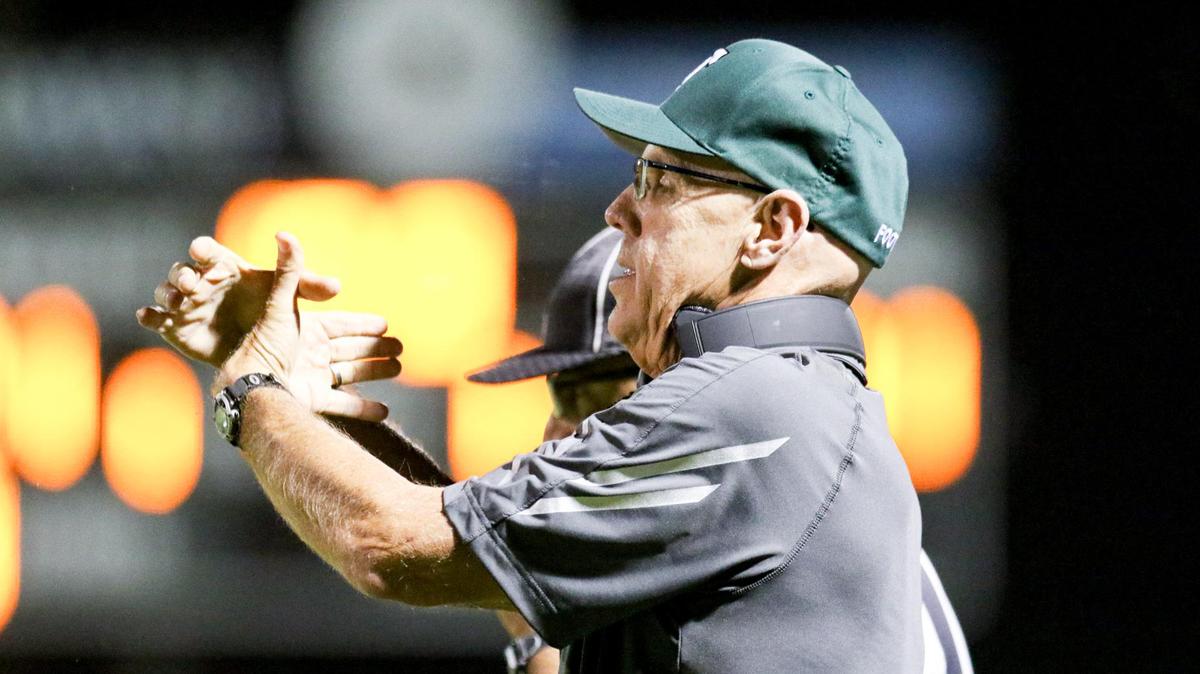 Templeton Head coach Don Crow send in signals in a game against Carmel in the third week of the High School football season on Sept. 6, 2019.