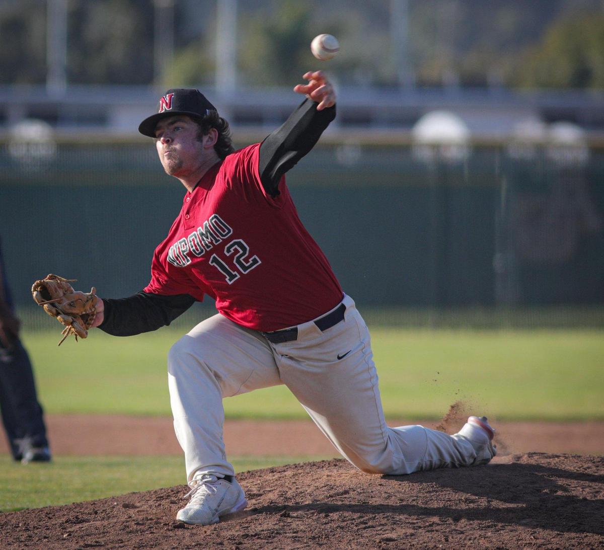Cole Gilson pitches for the Titans. Arroyo Grande won 12-1 over Nipomo May 17, 2022 in a baseball game at Arroyo Grande High School.