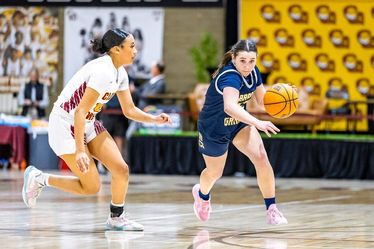 Sophia Robertson dribbles past a Clovis West defender.