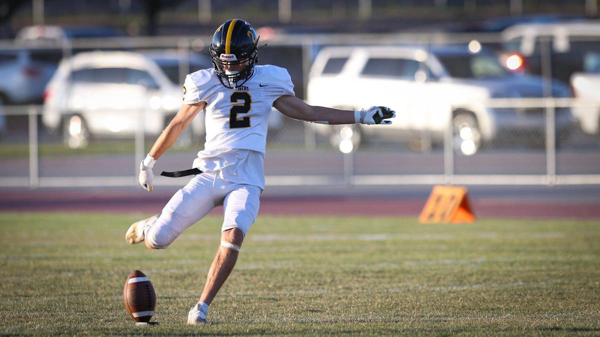 Miles DeBrum kicks for the Tigers. San Luis Obispo beat Nipomo 35-0 in the opening game of the season Aug. 19, 2022.