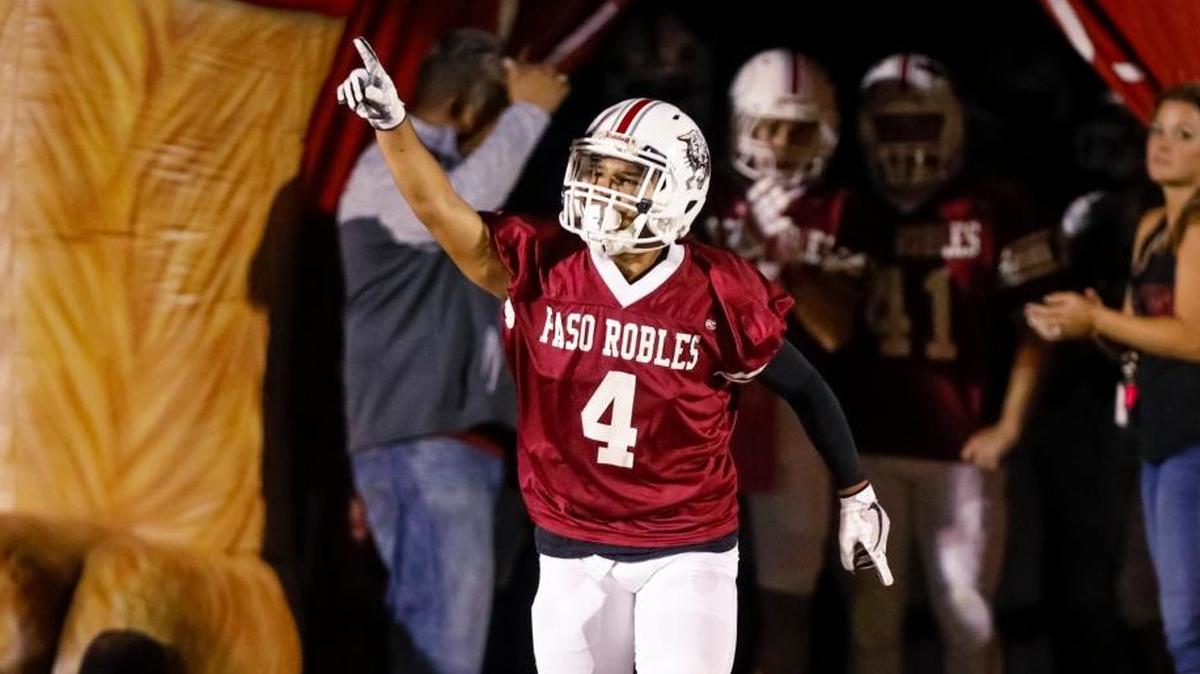 Senior Orlando Quintana runs on to the field before the Paso Robles High School football team plays host to Righetti on Homecoming last Friday. The Bearcats will go for the outright PAC 5 title Friday against rival Atascadero.