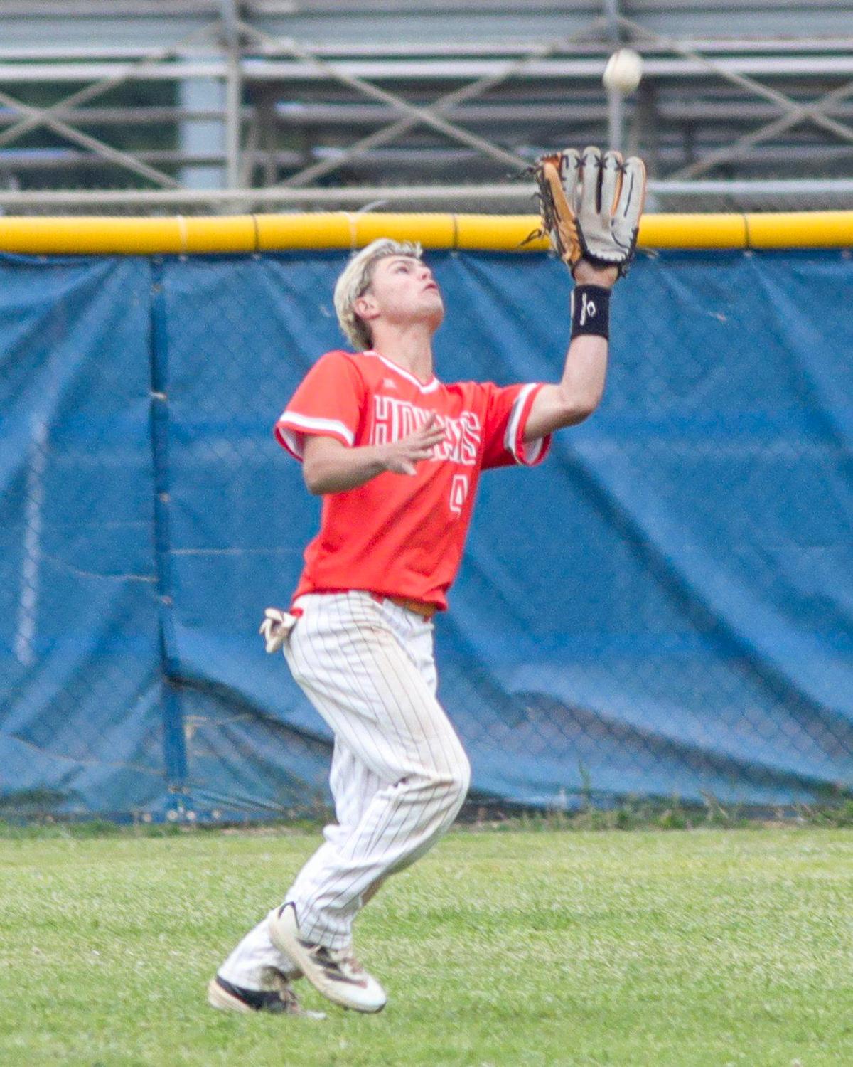 Uly Kaul lost his hat but makes a catch in the outfield. Atascadero won 6-4 in a baseball game against Morro Bay High School May 1, 2025.
