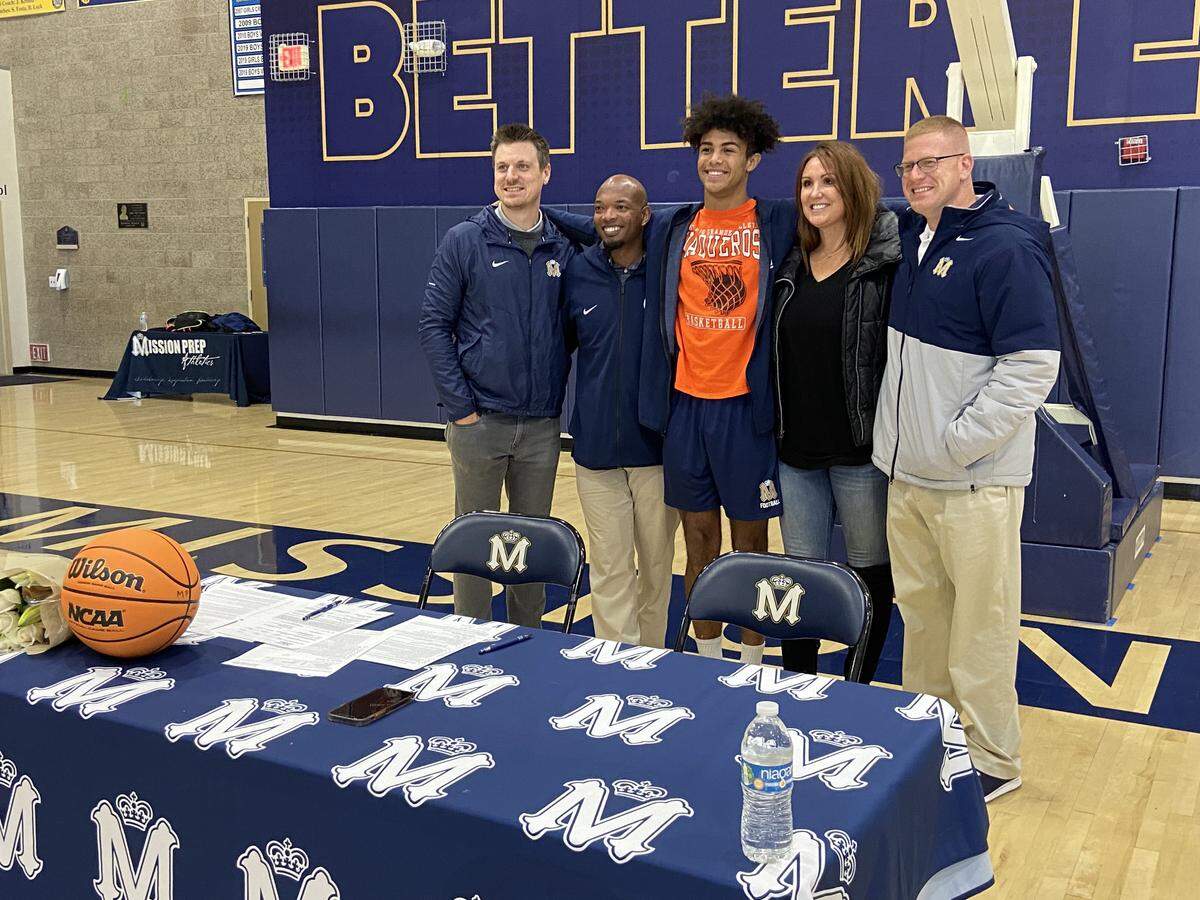 From left to right, Mission Prep’s Athletic Director Kevin Hitchen, Head Basketball Coach Terrance Harris, Jamar Howard (NCAA signee), Howard’s mother Jessica Smith and Howard’s football coach David Schuster.