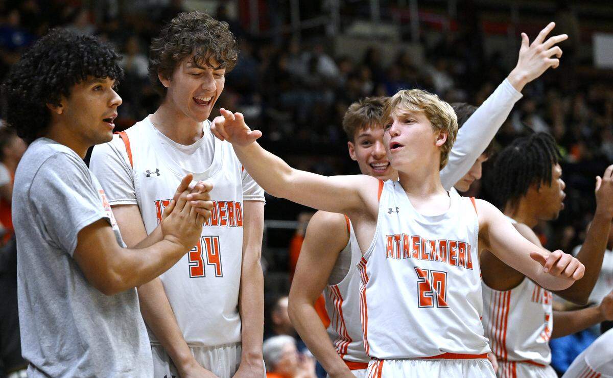 Atascadero’s bench cheers as the game is tied up against Clovis High in the CIF Central Section 2025-2026 DII Boys Basketball Championship held Friday, Feb. 27, 2026 at Selland Arena in Fresno.