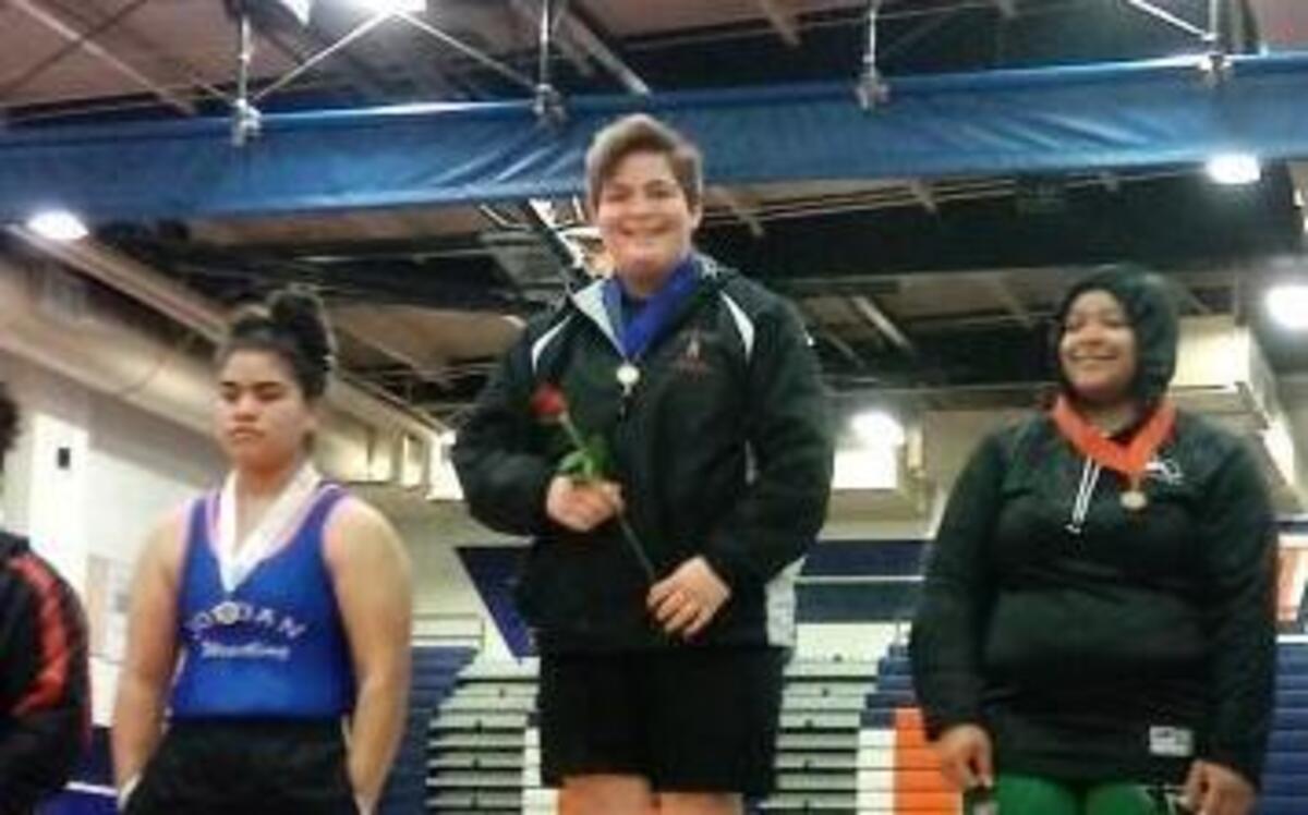 Nipomo High School’s Alexis Garcia receives a medal after she won the heavyweight division Saturday at the CIF-Southern Section Championships at Roosevelt High School in Corona.