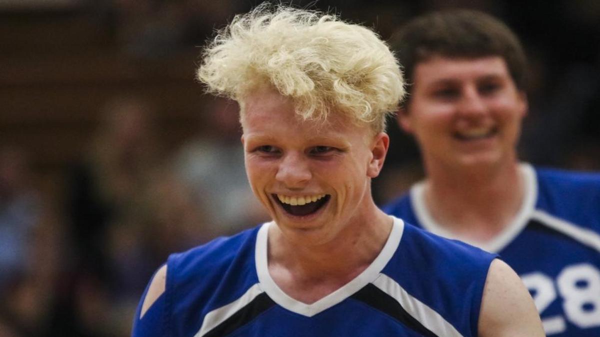 Arroyo Grande High boys volleyball junior Jackson Tourdot smiles after a kill in a win over SLO High to clinch the PAC 8 title.