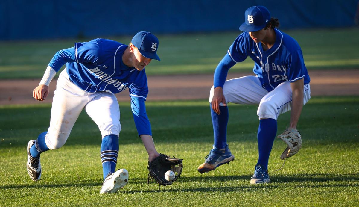 Jackson Howell fields a bunt from third base cutting in front of pitcher Morgan Codron. Morro Bay Pirates won 11-1 over Nipomo Titans in boys high school baseball March 22, 2022. Howell committed to St. Mary’s and Codron to University or Portland.