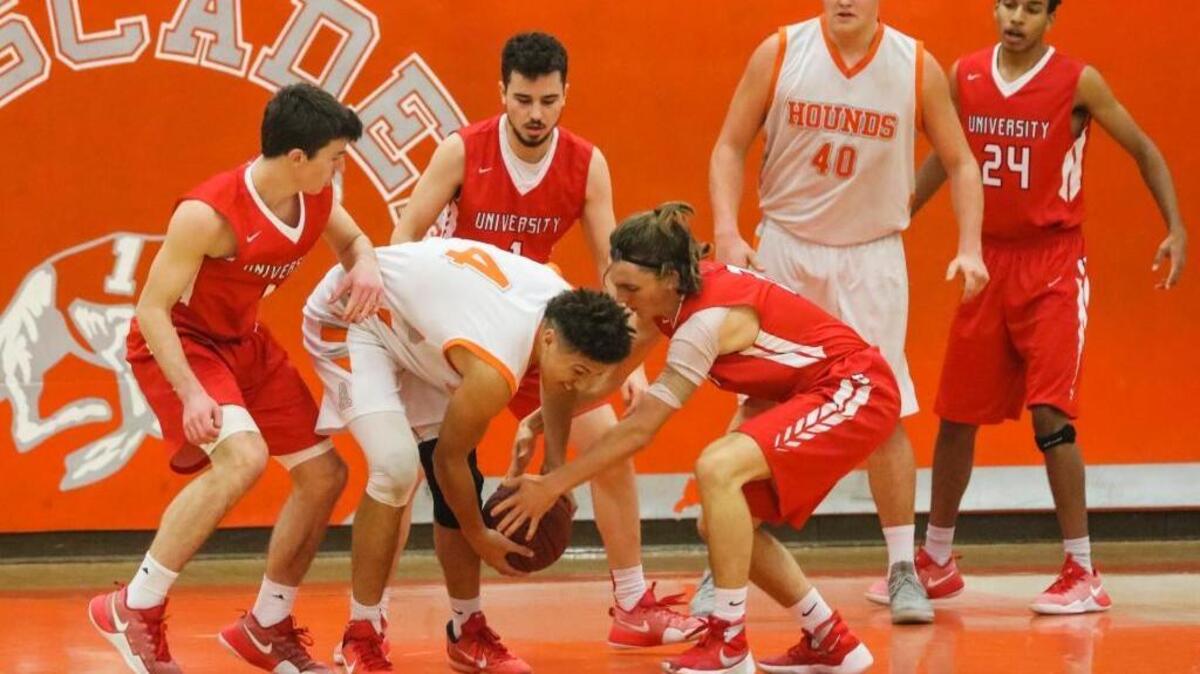 University High defenders swarm Atascadero senior Elijah Cooks in the championship game of the Atascadero Christmas Tournament.