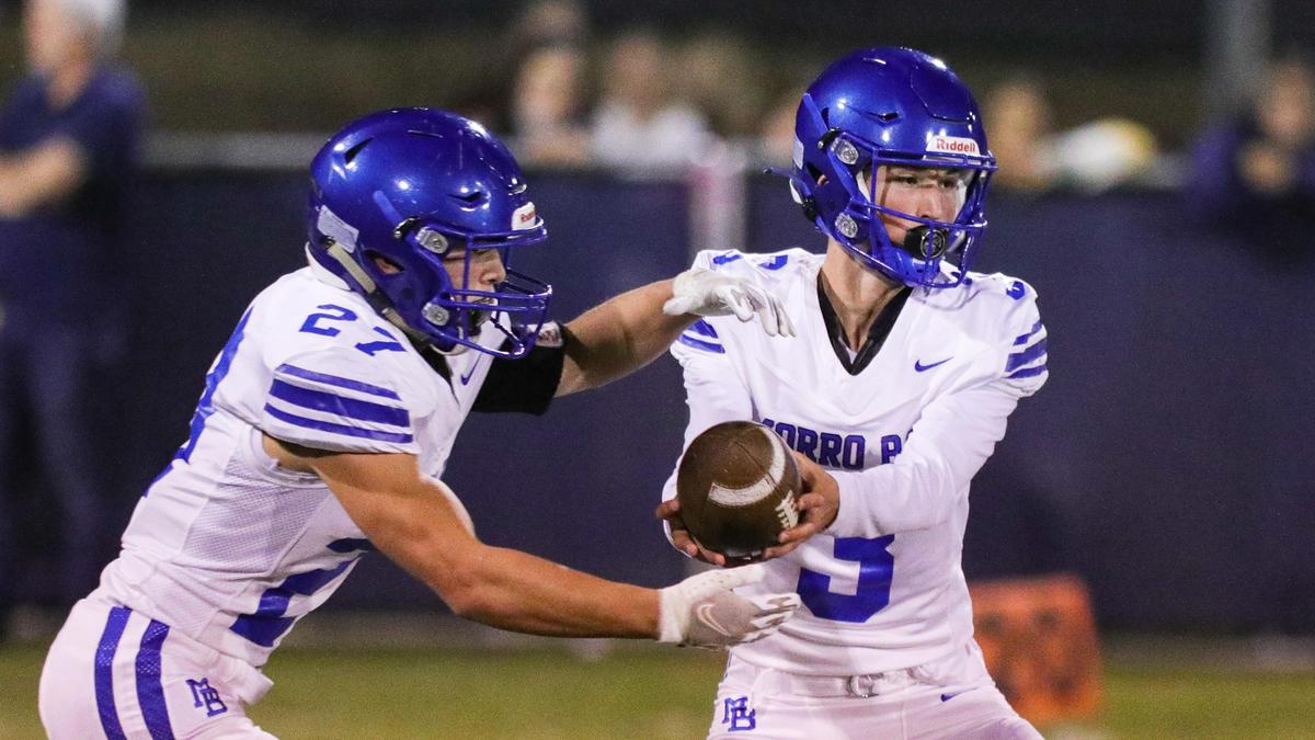 Nicky Johnson hands off to Nathan Pech. Mission Prep scored often and kept Morro Bay out of the end zone finishing with a 60-3 win.