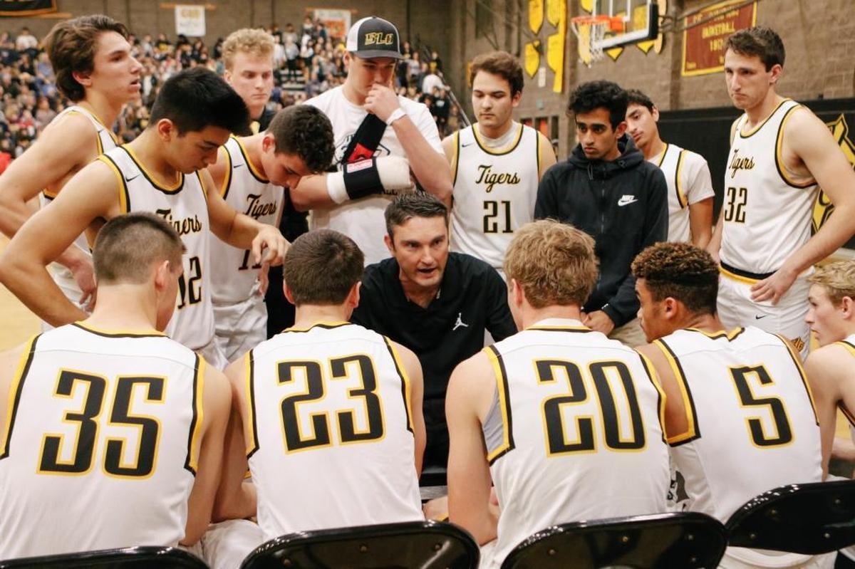 San Luis Obispo High School boys basketball Coach Jeff Brandow talks to the team during the SLO Town Showdown against Mission Prep in 2018.