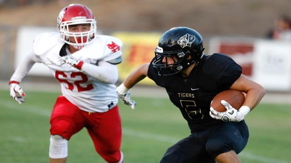 Marcos Moreno of Santa Maria pursues Pierson Mosichuk of San Luis Obispo in the teams’ high school football 2017 season opener.