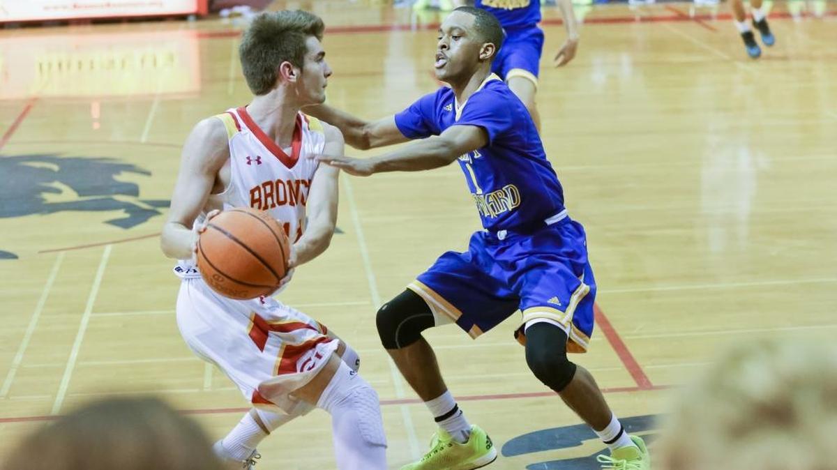 Coast Union High’s Jez Lawson is pressured by a St. Bernard defender during the Broncos’ loss in the CIF-Southern Section Division 5A playoffs Friday night in Cambria.