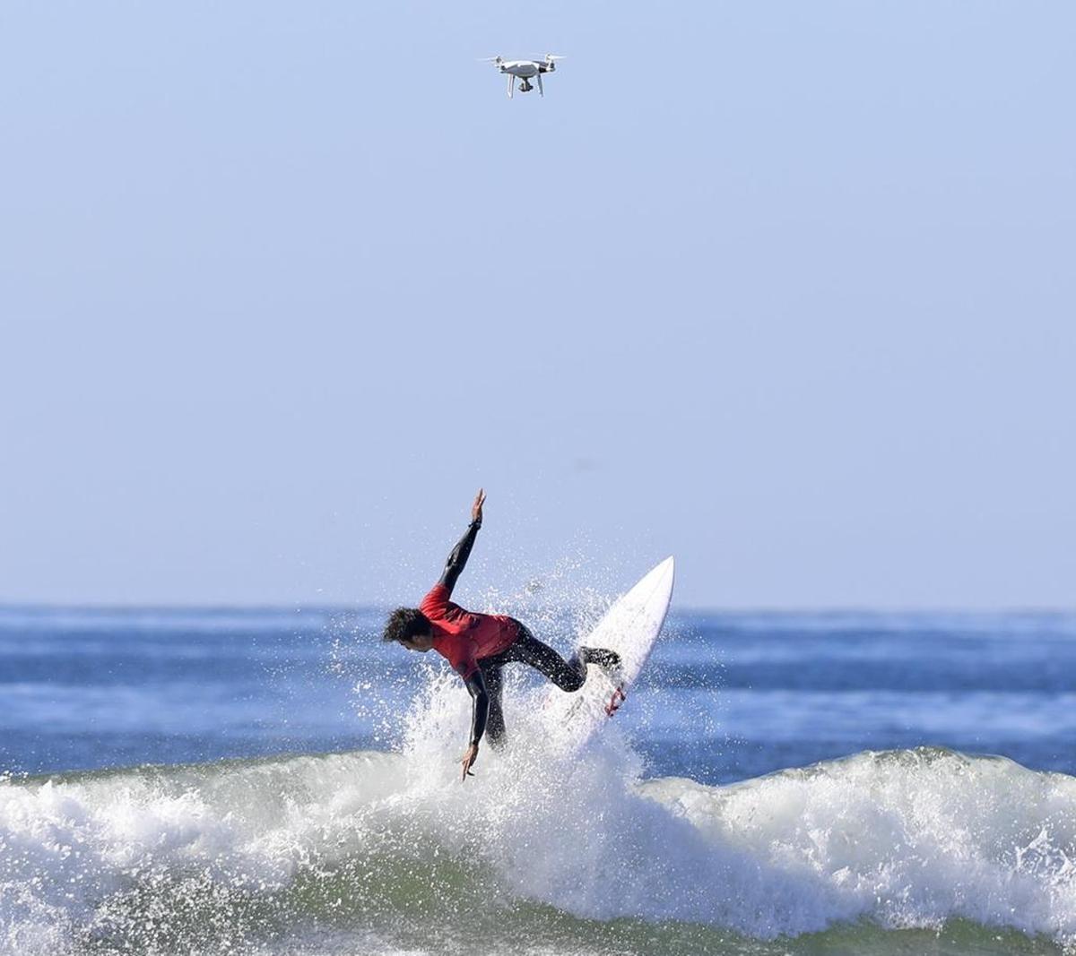 The final day of the Pismo Beach Open surf contest held next to Pismo Pier in Pismo Beach, Sunday, November 19, 2017. Second-place finisher Ian Gentil goes vertical while being filmed live by a drone overhead.