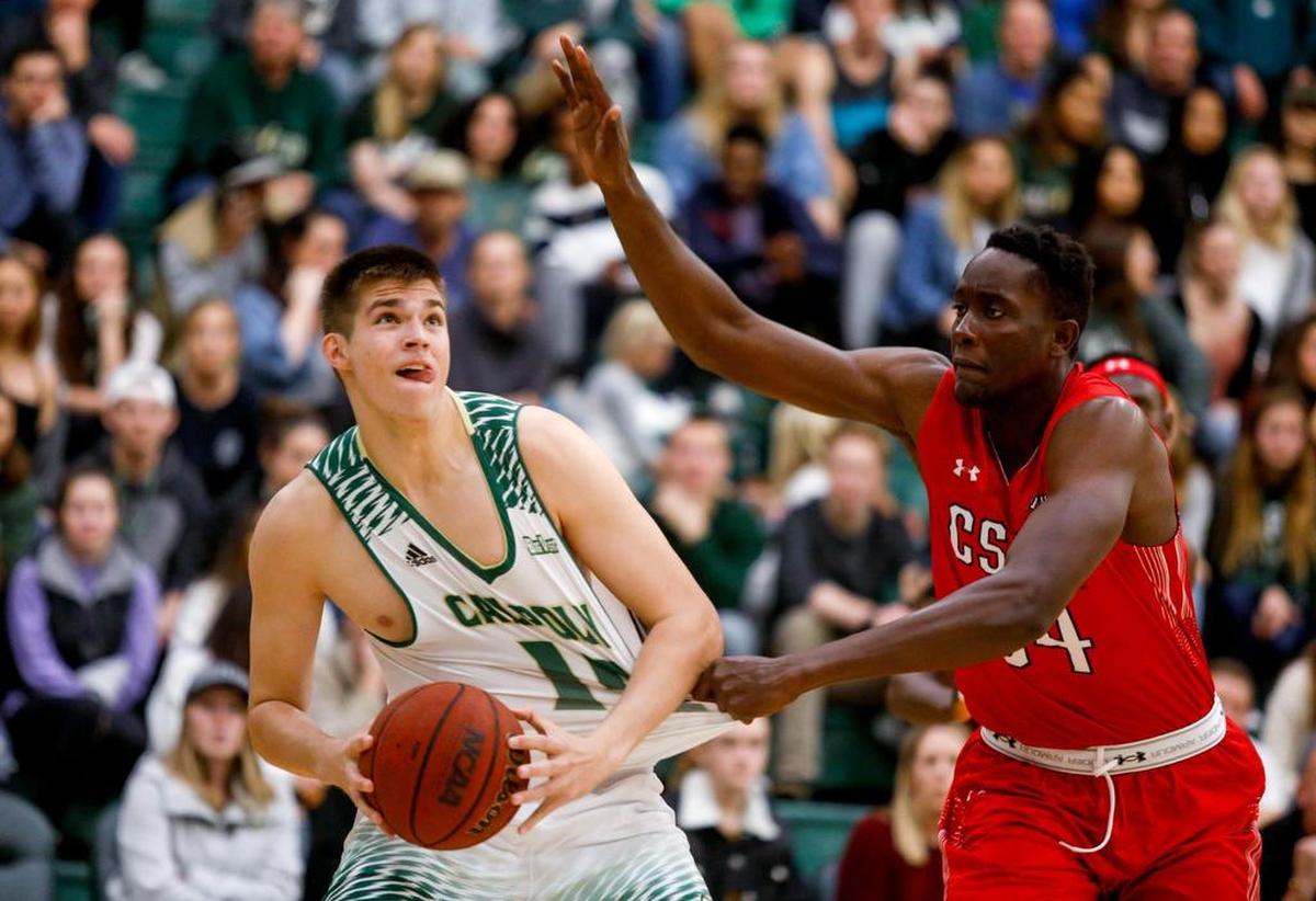 Cal Poly’s Tuukka Jaakkola is fouled by CSUN’s Mahamadou Daba-Camara during their basketball game in San Luis Obispo, California, on Jan. 12, 2019. International student-athletes will be affected by a new U.S. Immigrations and Customs Enforcement policy.