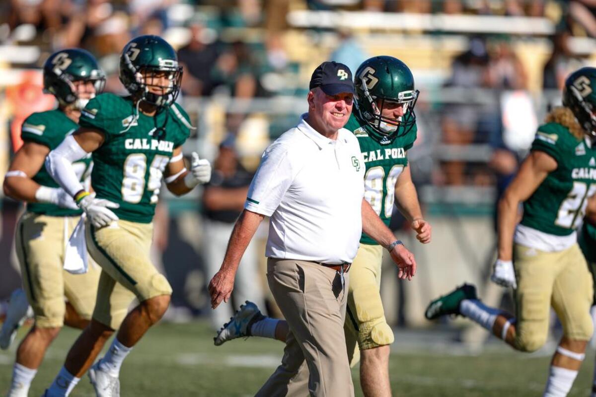 Head Coach Tim Walsh takes the field at the start of the game against UC Davis in 2018. Walsh announced his retirement in November.