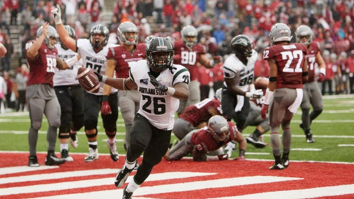 Portland State running back Steven Long (26) celebrates his touchdown against Washington State during the second half of the Vikings’ 24-17 victory in Pullman, Wash.